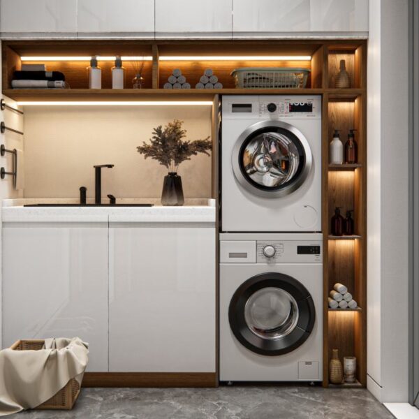 Nowoczesna zabudowa pralki i suszarki w słupku, wkomponowana w elegancką łazienkę z drewnianymi akcentami i oświetleniem LED.